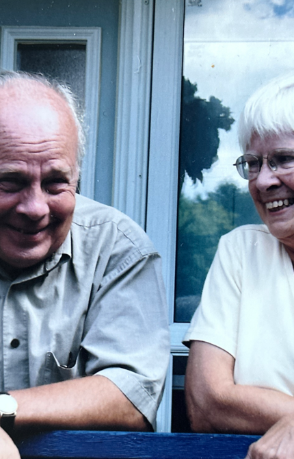 A candid image of Timothy and Bonnie McGee laughing at some unknown joke