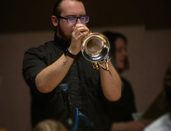 Riley Kelly plays flugelhorn in a performance with the U of T Jazz Orchestra