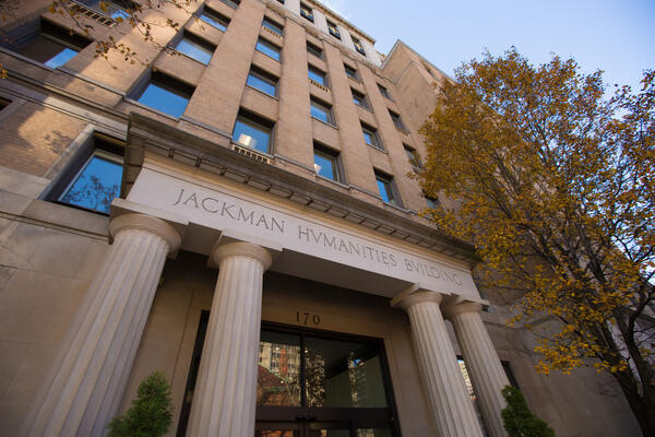 View of the Jackman Humanities Building from below, highlighting its unique architecture and intricate design.