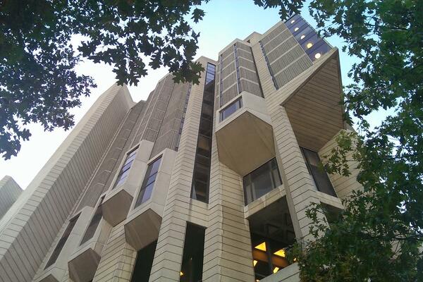 View of Robarts Library building from below, showcasing the unique architecture and intricate design of the structure.