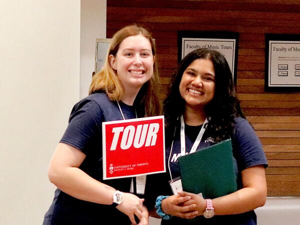Two smiling tour guides.