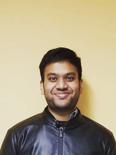 Head shot of Yasir Arafat wearing a black jacket