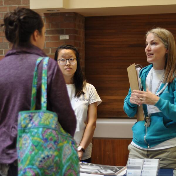 Admissions staff speak with prospective students at Fall Campus Day.