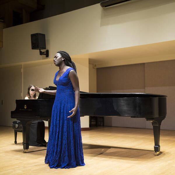 U of T voice student in performance in Walter Hall.