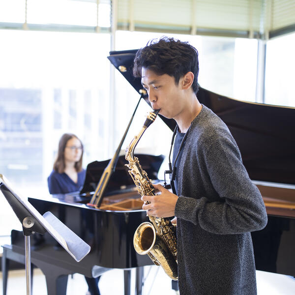 U of T saxophonist rehearses with a pianist.