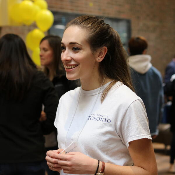Student Ambassador welcoming a prospective student at a previous Fall Campus Day.